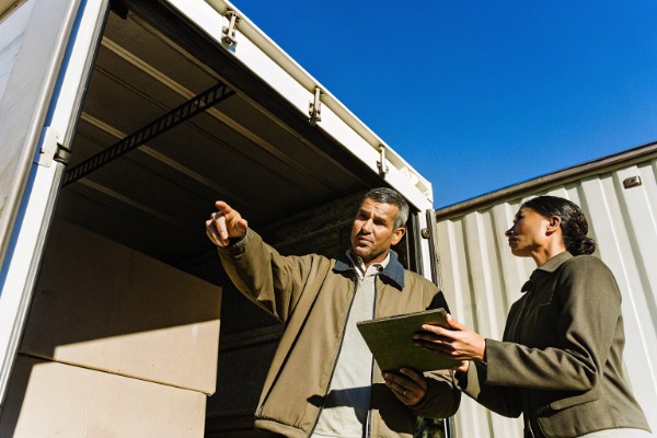 Two managers inspecting delivery truck cargo (ID#5)
